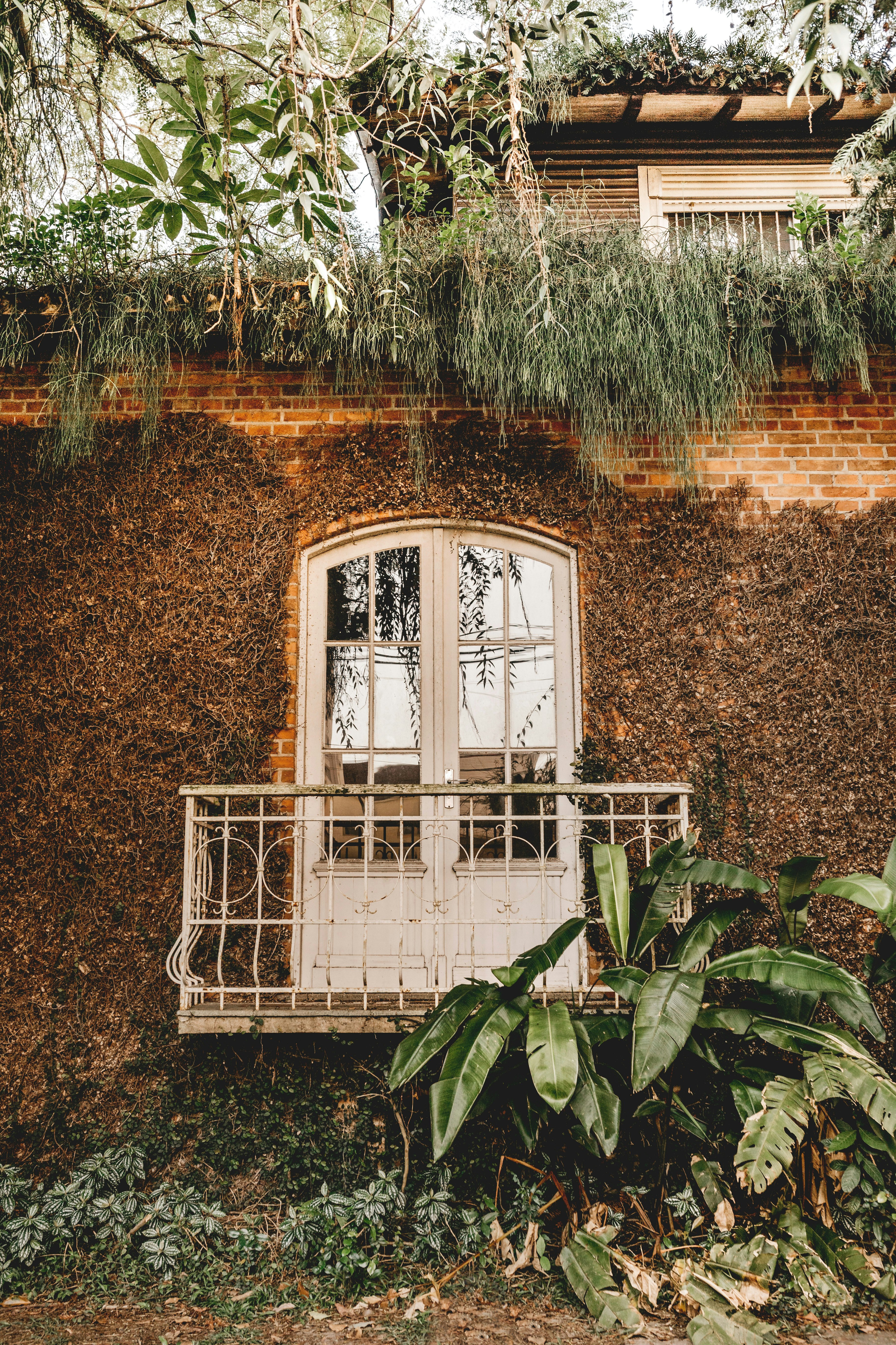 white wooden window frame on brown concrete wall